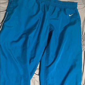 blue Nike track pants